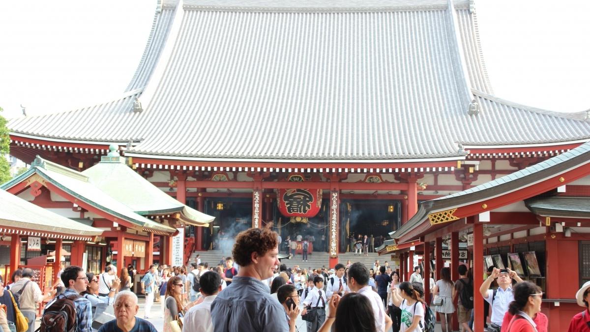 crowd in front of a Buddhist temple