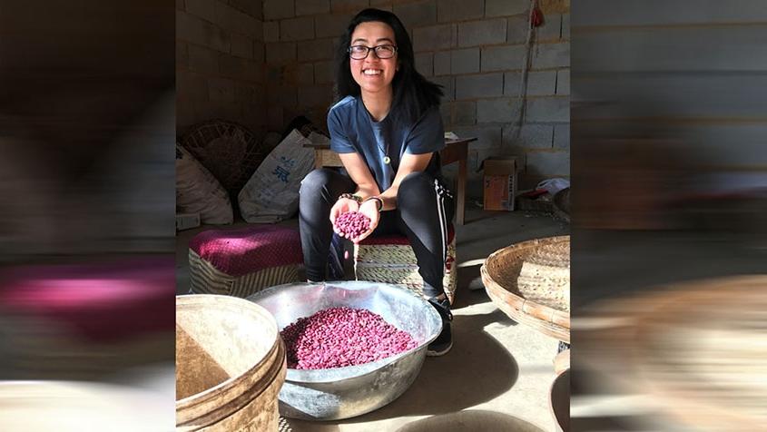 Student Michelle Nguyen posing with beads in China 