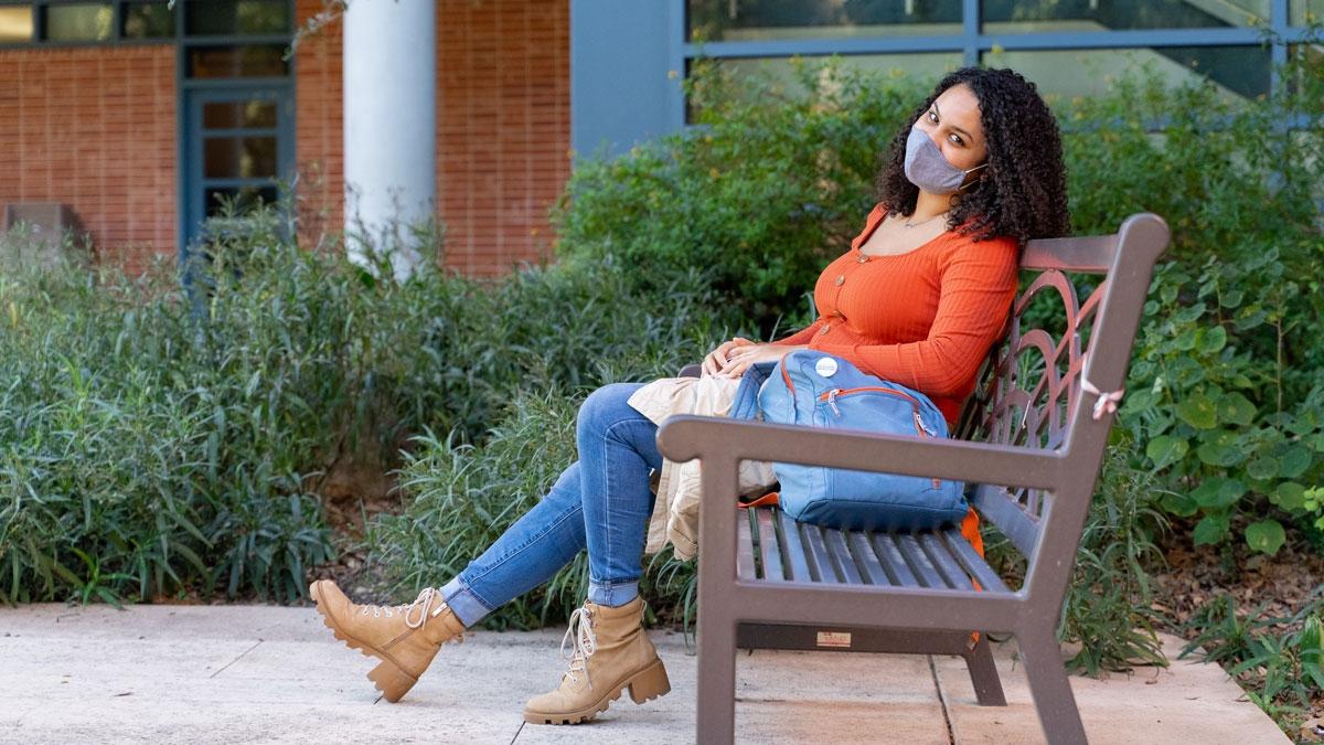 Caelia Marshall sits on bench